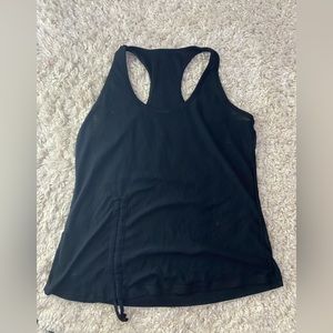 Black tank top,good for running,sinches on the side